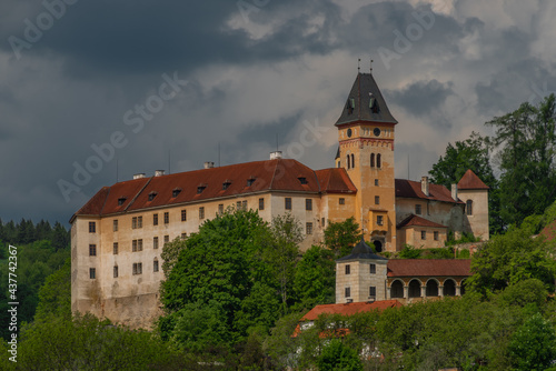 Castle on big hill in Vimperk town in spring sunny and cloudy day