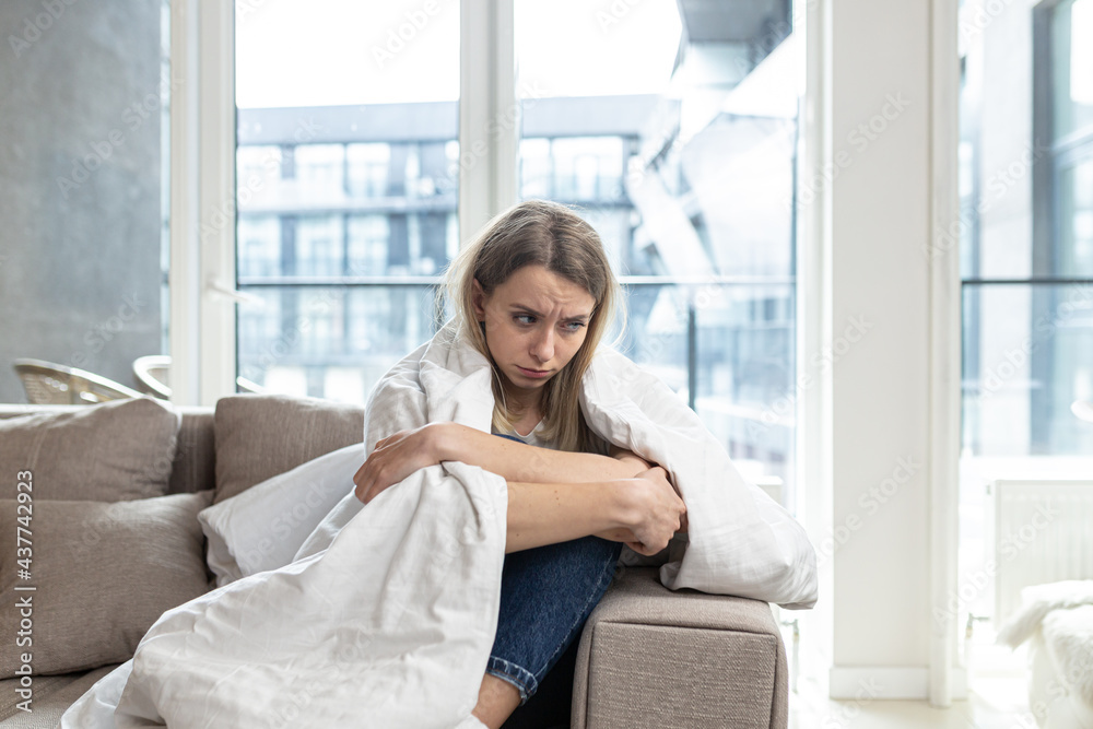 Portrait young woman sitting on sofa at home depressed. Girl is having a hard time with stress. Caucasian female indoors alone worried about problems. unhappy blonde student in living room or bedroom
Portrait young woman sitting on sofa at home depressed. Girl is having a hard time with stress. Caucasian female indoors alone worried about problems. unhappy blonde student in living room or bedroom