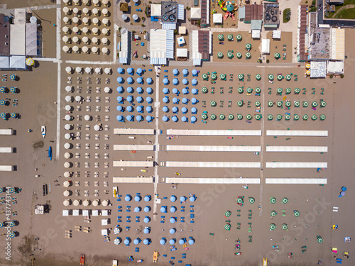 Italy June 2021, aerial view of beach umbrellas on the Romagna Riviera