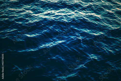 Deep blue ocean water texture, dark sea waves background as nature and environmental design. © Anneleven