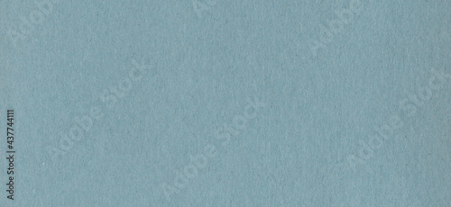 Clean blue cardboard paper background texture. Horizontal banner