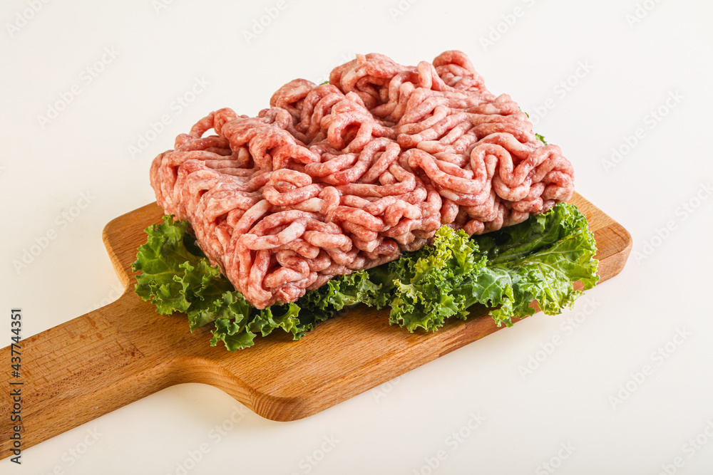 Raw pork minced meat over board Raw pork minced meat over board