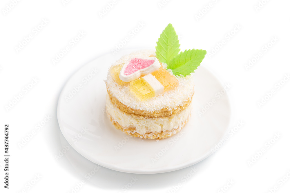 Decorated cake with milk and coconut cream isolated on white background. Side view. Decorated cake with milk and coconut cream isolated on white background. Side view.