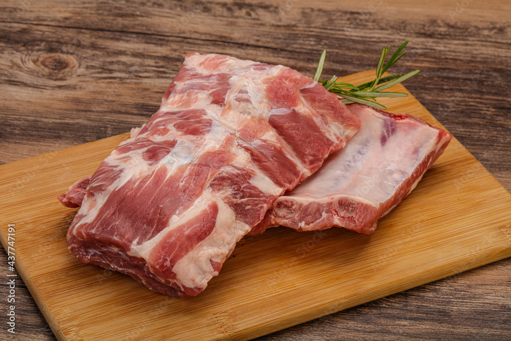 Raw pork ribs served rosemary Raw pork ribs served rosemary