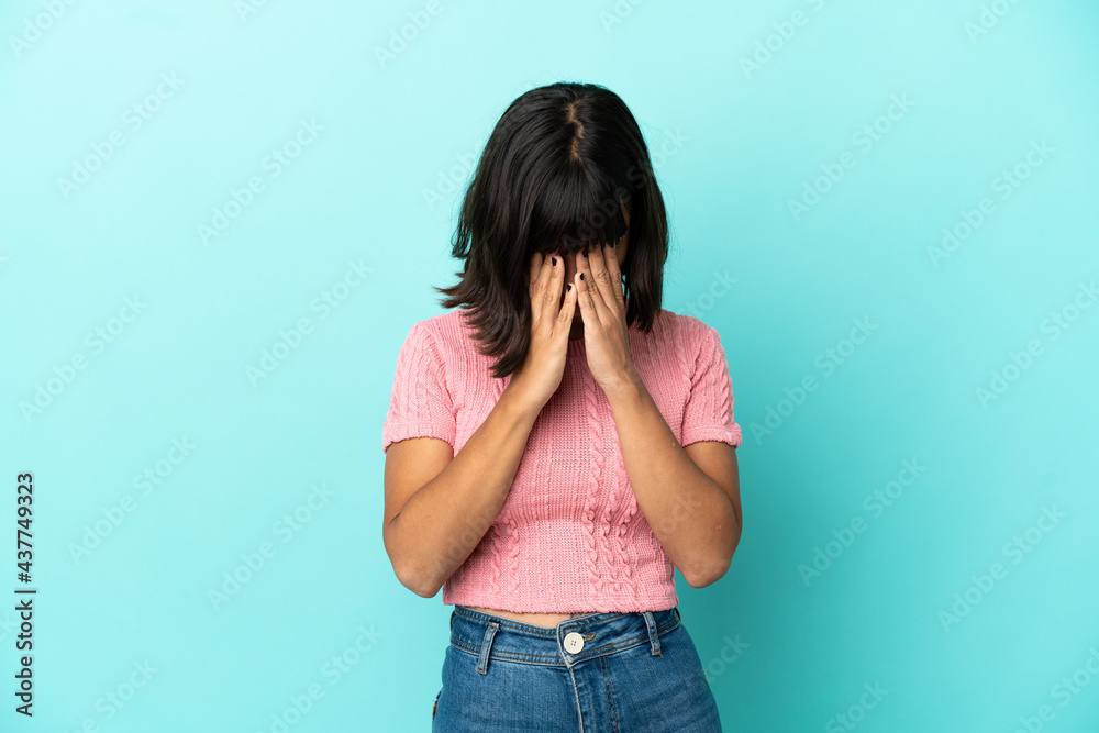 Young mixed race woman isolated on blue background with tired and sick expression Young mixed race woman isolated on blue background with tired and sick expression