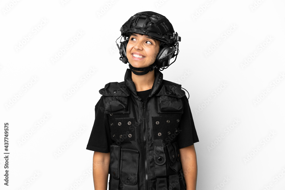 SWAT woman isolated on white background thinking an idea while looking up SWAT woman isolated on white background thinking an idea while looking up