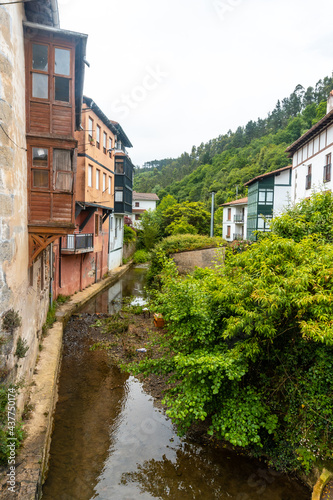 Houses on the river of the Ea municipality near Lekeitio, Bay of Biscay in Cantabria. Basque Country