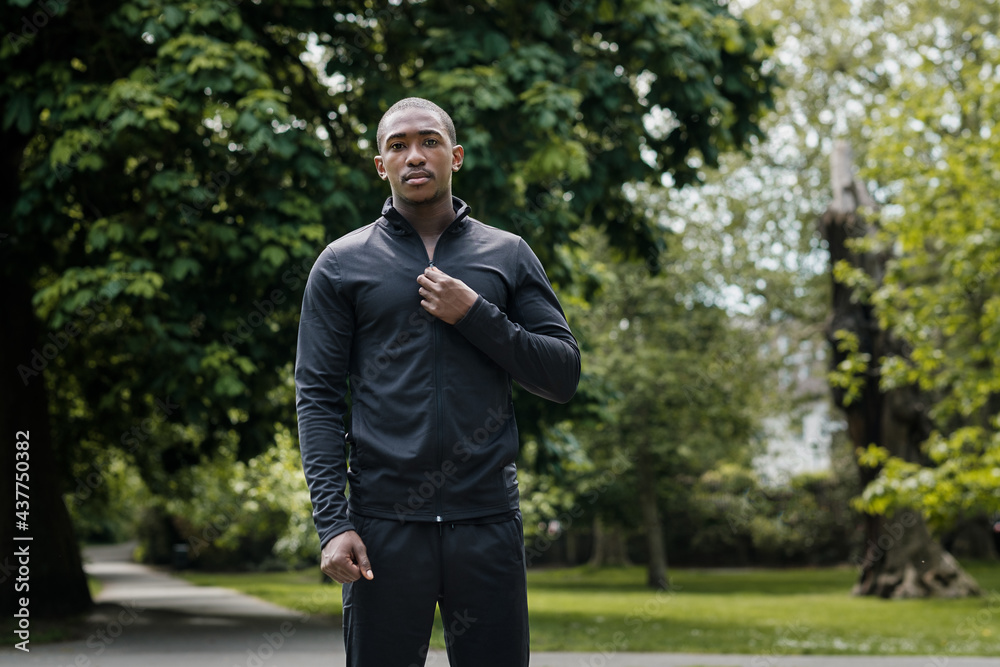 Portrait of black male athlete posing in a park. Portrait of black male athlete posing in a park.