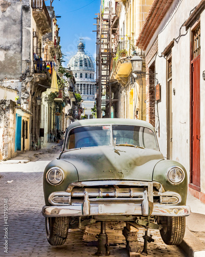 Old car under repair in the Old Havana streets © Michel