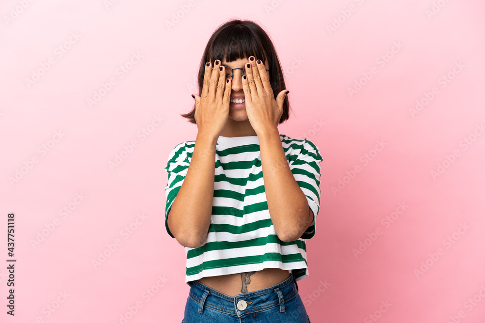 Young mixed race woman isolated on pink background covering eyes by hands Young mixed race woman isolated on pink background covering eyes by hands
