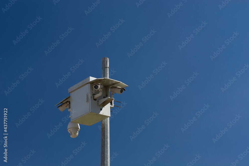 CCTV street cameras on pole.