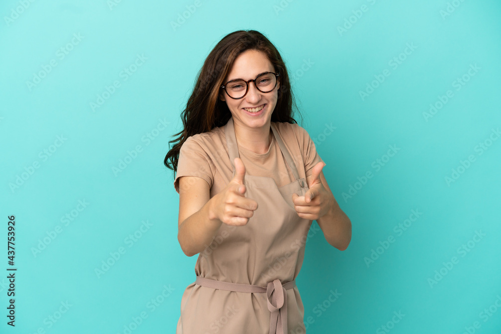 Restaurant waiter pointing to the front and smiling Restaurant waiter pointing to the front and smiling
