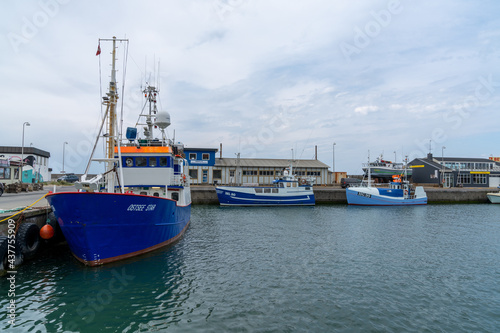 colorful fishing boats in the industrial port and harbor of Hirtshals © makasana photo
