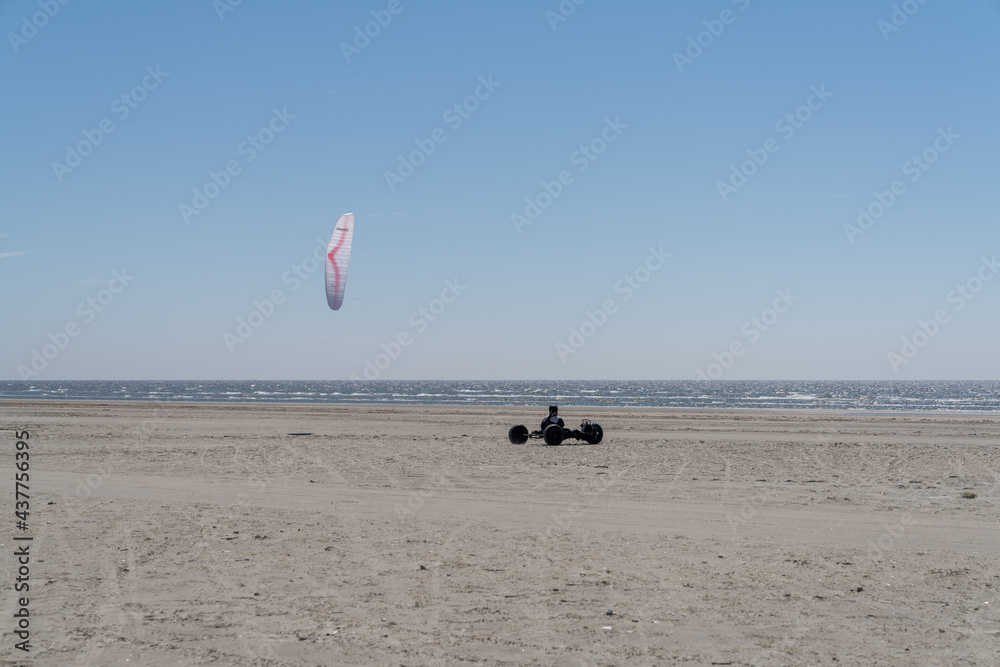 Obraz premium kite buggy enjoying a windy day on the Wadden Sea island beaches of western Denmark