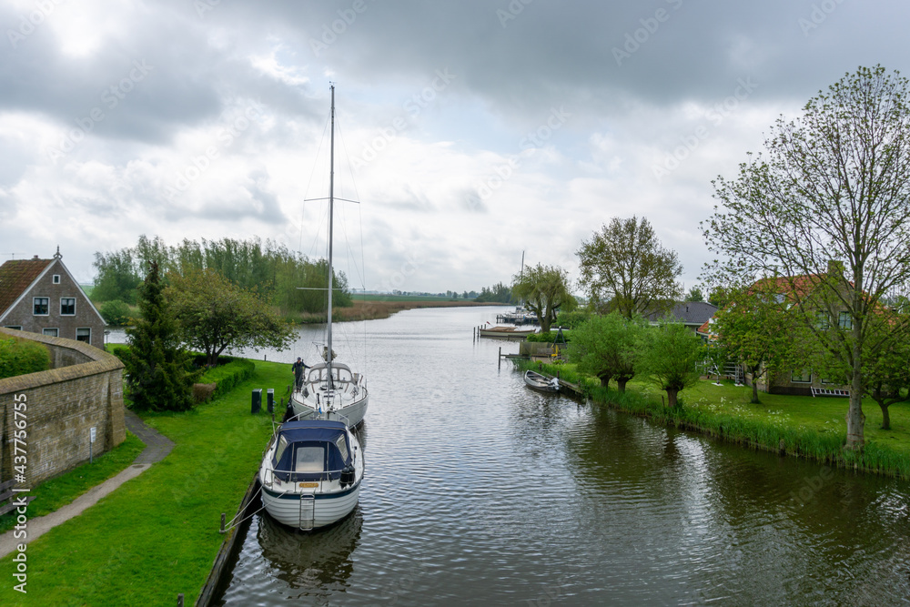 sailboat at anchor in the canals near Sloten
