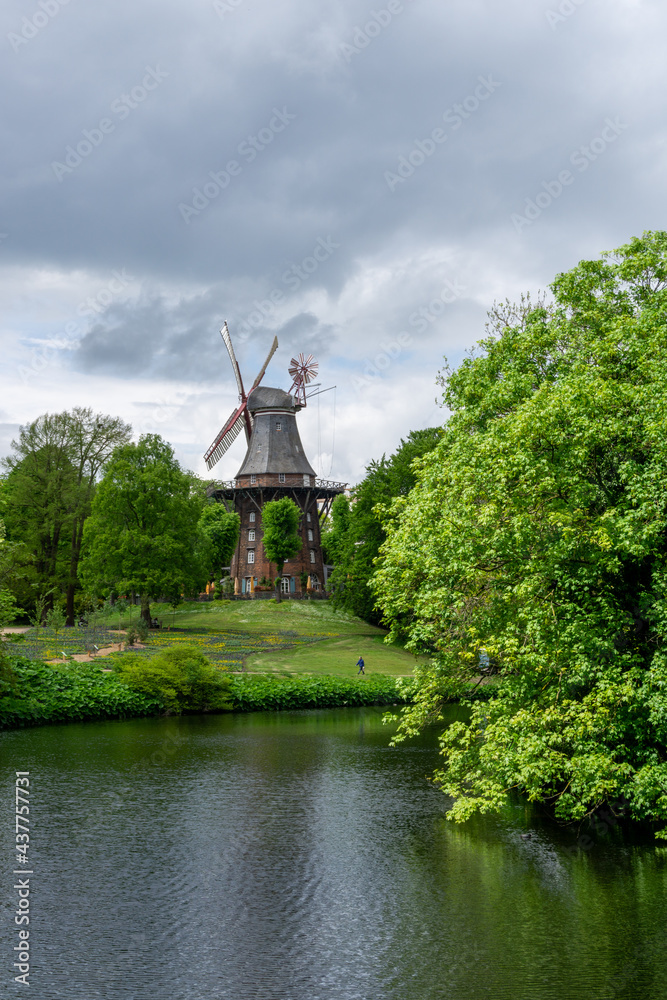 view of the historic Am Wall windmill in the old moat and city park of Bremen