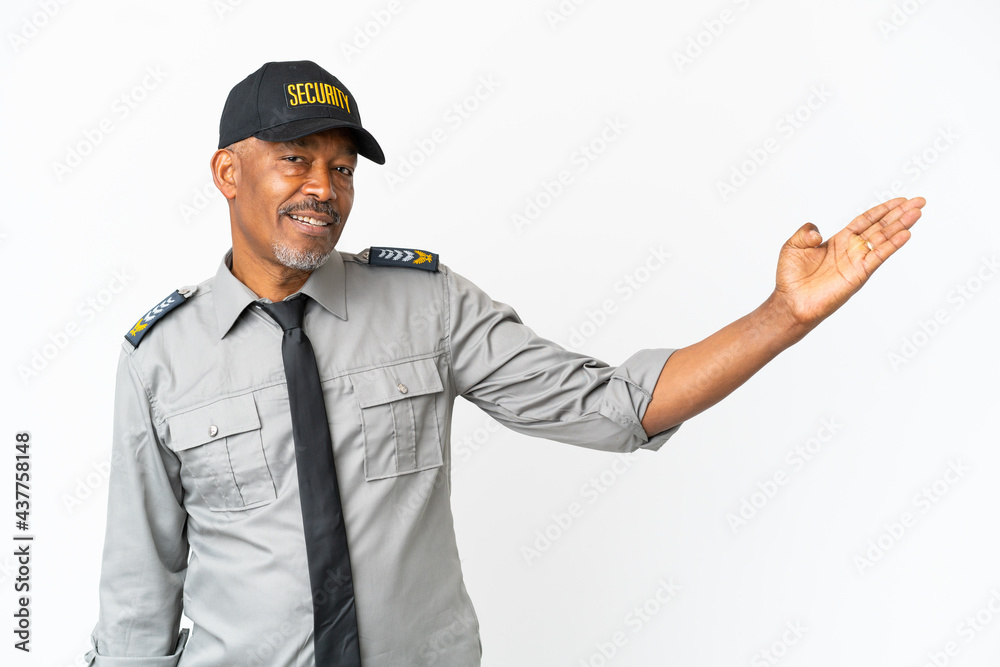 Senior staff man isolated on white background extending hands to the side for inviting to come Senior staff man isolated on white background extending hands to the side for inviting to come