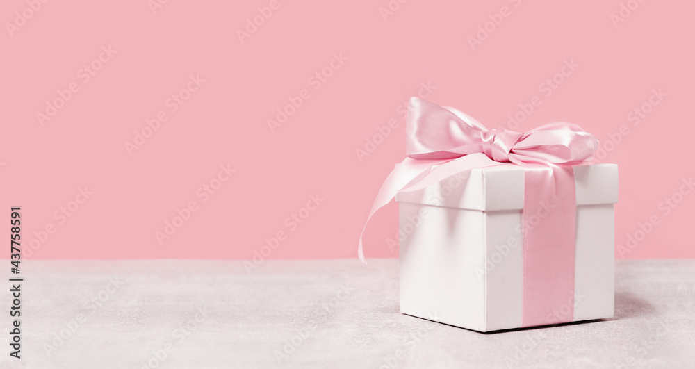 White square gift box with pink bow and ribbon Vector Image