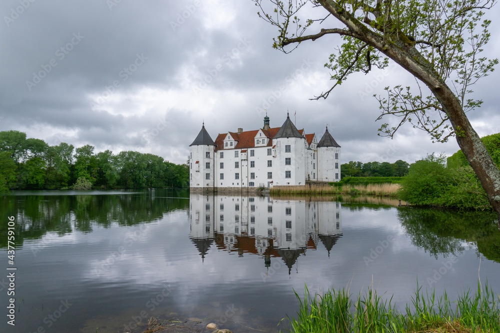 view of the Gluecksburg castle in northern Germany with beautiful reflections in the lake view of the Gluecksburg castle in northern Germany with beautiful reflections in the lake