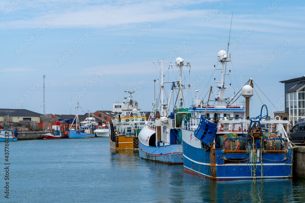 colorful fishing boats in the industrial port and harbor of Hirtshals