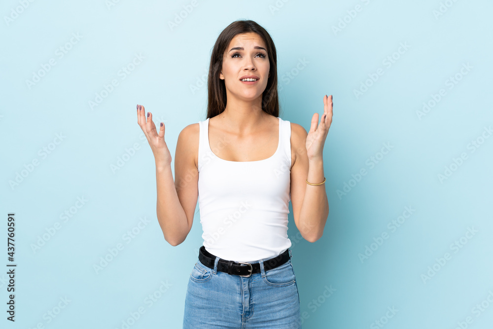 Young caucasian woman isolated on blue background stressed overwhelmed Young caucasian woman isolated on blue background stressed overwhelmed
