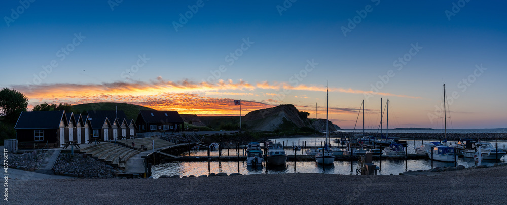 colorful sunset over the small marina and harbor at Ejerslev Lynd in northern Jutland