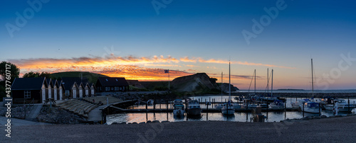 colorful sunset over the small marina and harbor at Ejerslev Lynd in northern Jutland © makasana photo