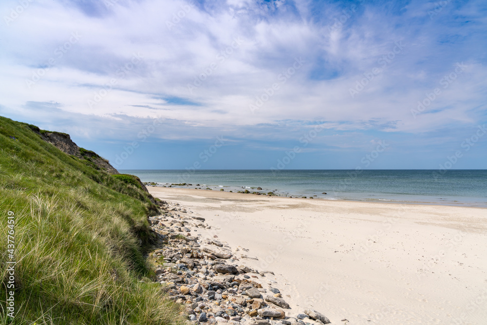 beautiful white sand beach with high grassy sand dunes behind beautiful white sand beach with high grassy sand dunes behind