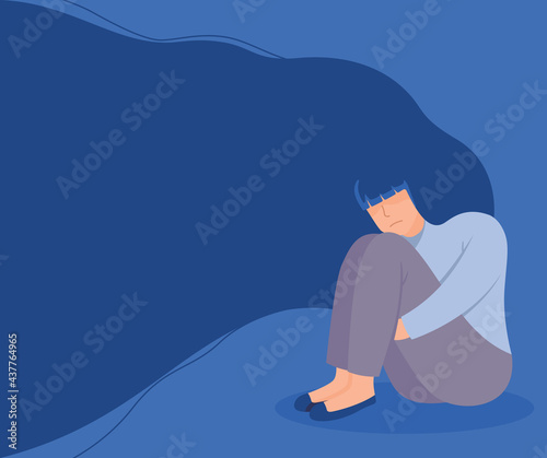 Unhappy girl sitting and hugging her knees in the corner. Sad lonely woman in depression with flying hair. Depressed person. Man under stress concept