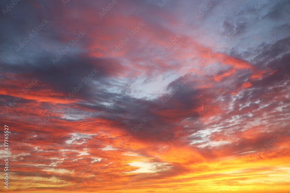 Sunset on colorful sky with red and orange clouds. Picturesque landscape for background with soft colors