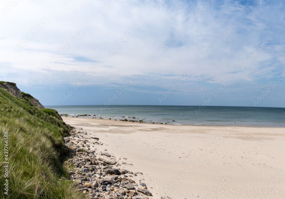 beautiful white sand beach with high grassy sand dunes behind beautiful white sand beach with high grassy sand dunes behind