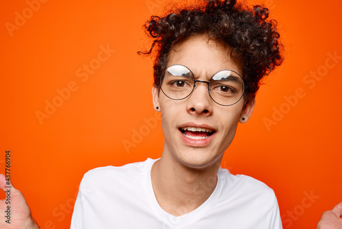 guy with curly hair white t-shirt emotions glasses studio © SHOTPRIME STUDIO