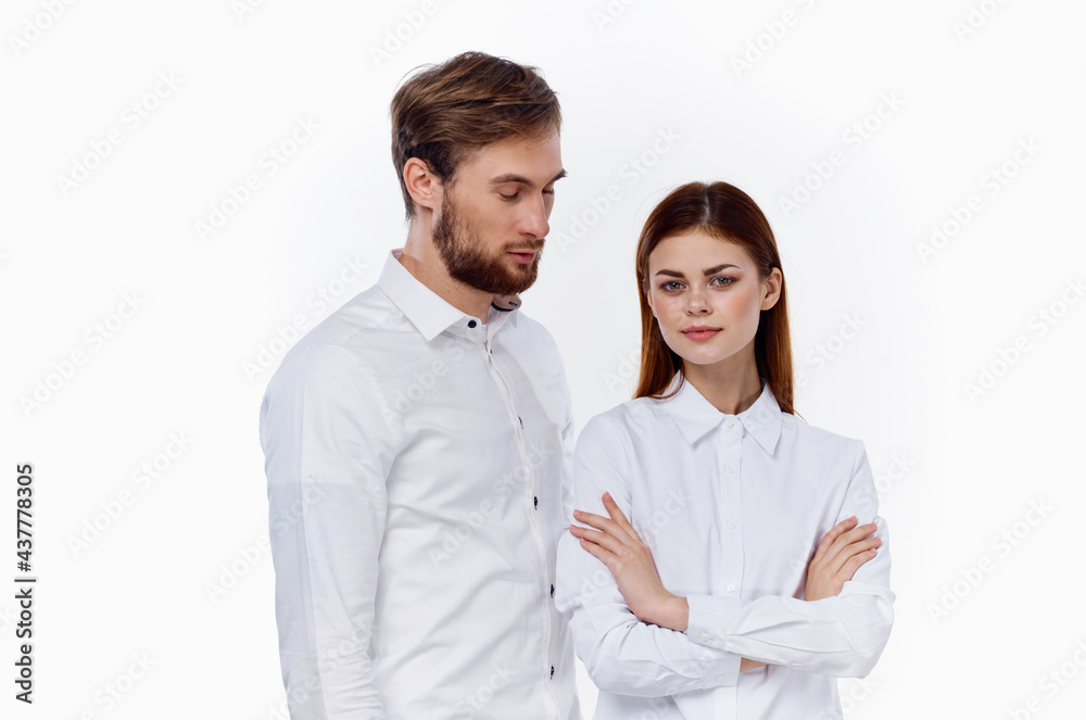 fashionable men and women in the same shirts on a light background communication friends fashionable men and women in the same shirts on a light background communication friends