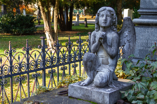 A statue of an angel on an ancient tombstone at the Ondrejský cintorín (St. Andrew's Cemetery) in Bratislava. Bratislava, Slovakia. 2020-11-07. 