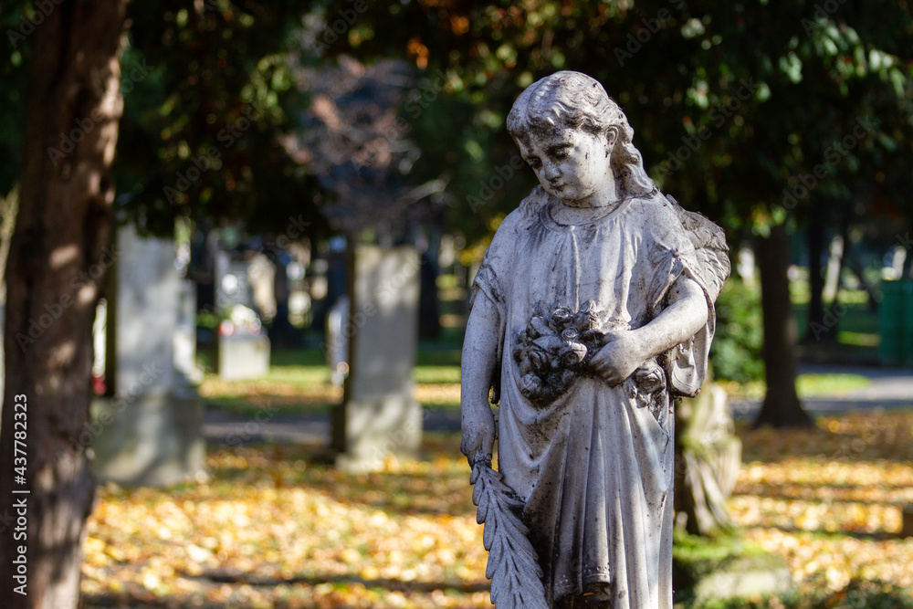 A statue of an angel on an ancient tombstone at the Ondrejský cintorín (St. Andrew's Cemetery) in Bratislava. Bratislava, Slovakia. 2020-11-07. A statue of an angel on an ancient tombstone at the Ondrejský cintorín (St. Andrew's Cemetery) in Bratislava. Bratislava, Slovakia. 2020-11-07.