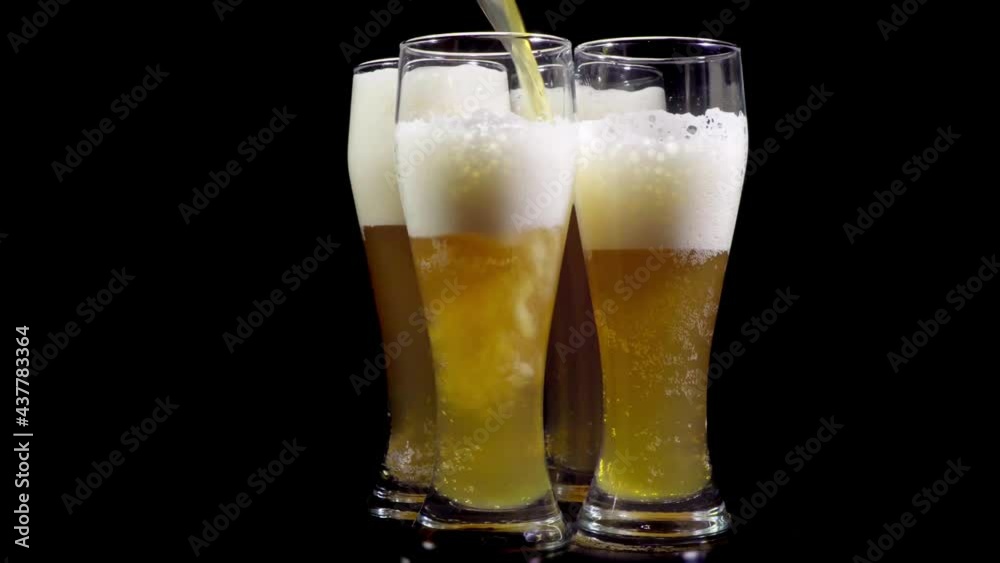 Four glasses of beer in a minimalist interior, dolly shot Four glasses of beer in a minimalist interior, dolly shot