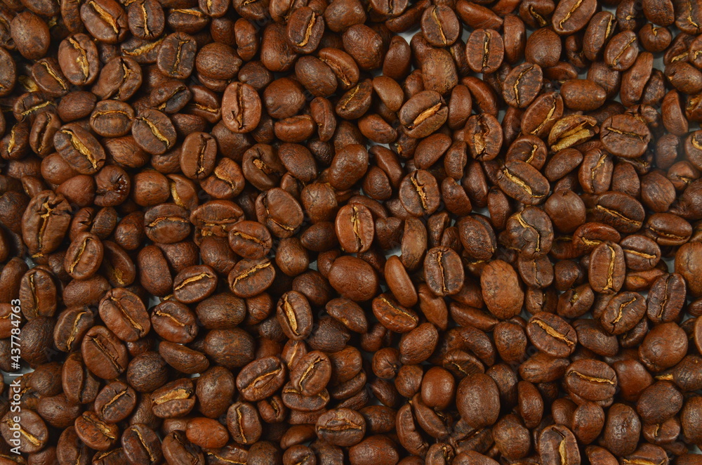 Fototapeta premium roasted coffee beans, brown coffee, background texture, close-up