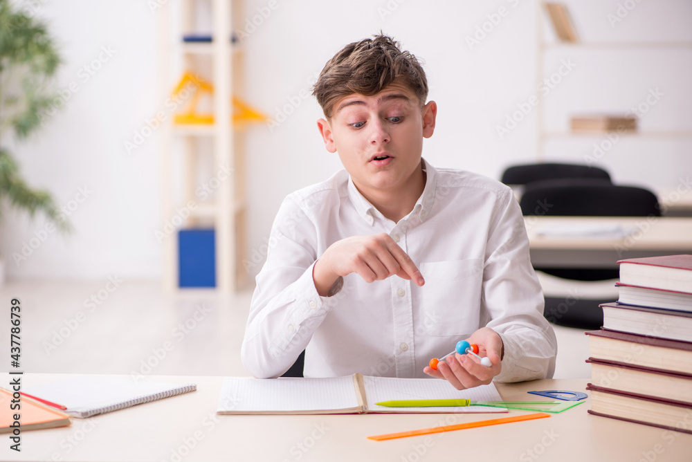 Boy stadying chemistry in the classrom Boy stadying chemistry in the classrom