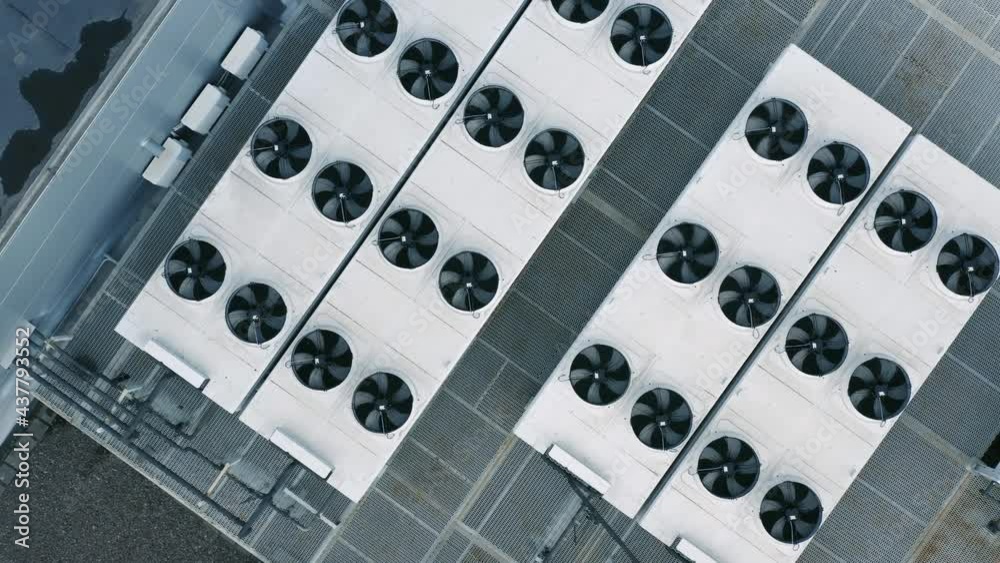 Heating, ventilation and air conditioning systems installed on a rooftop. Aerial top down view Heating, ventilation and air conditioning systems installed on a rooftop. Aerial top down view