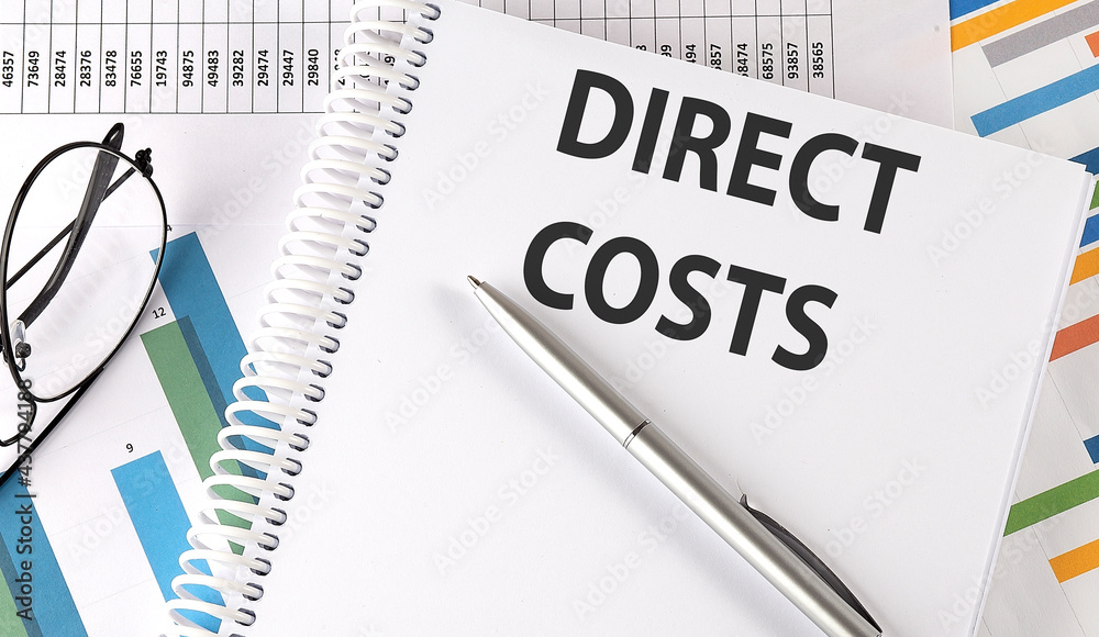 DIRECT COSTS , pen and glasses on chart DIRECT COSTS , pen and glasses on chart
