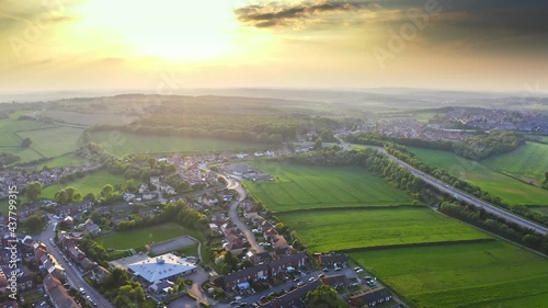 Drone shot of the town of Hemingfield in Barnsley, UK. Golden hour with big sunset. photo