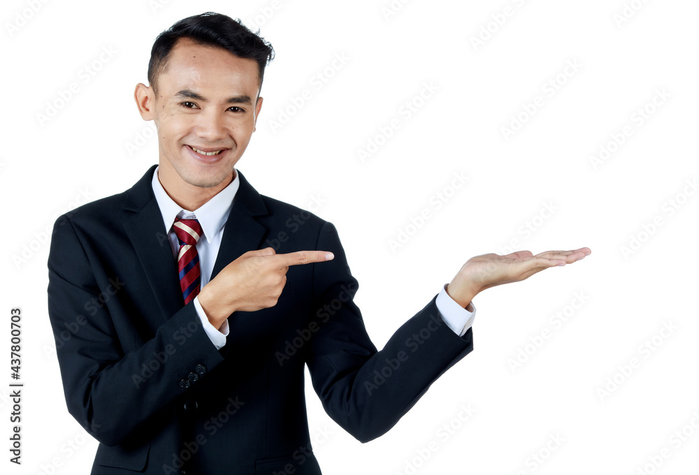 Young attractive asian business man wearing black suit with white shirt and necktie smiling and looking confident point his finger out to another hand to show some product. White background isolated Young attractive asian business man wearing black suit with white shirt and necktie smiling and looking confident point his finger out to another hand to show some product. White background isolated