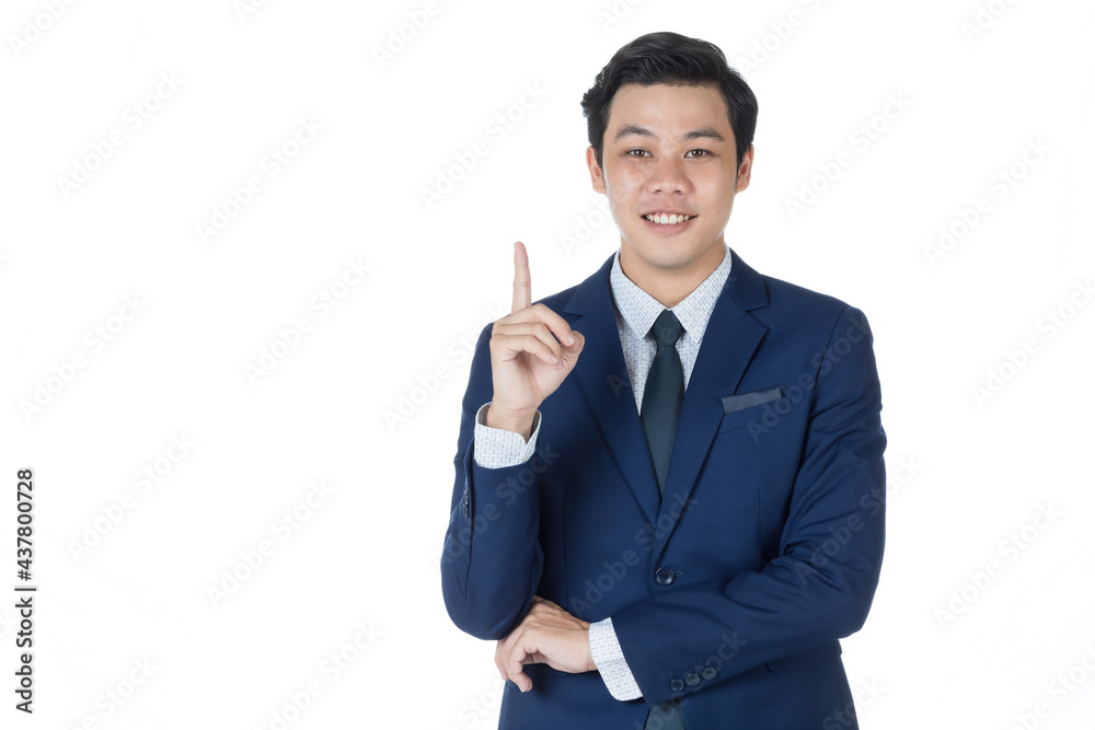 Young attractive asian business man wearing navy blue suit with white shirt and necktie raise his index finger and smile in white background isolated Young attractive asian business man wearing navy blue suit with white shirt and necktie raise his index finger and smile in white background isolated