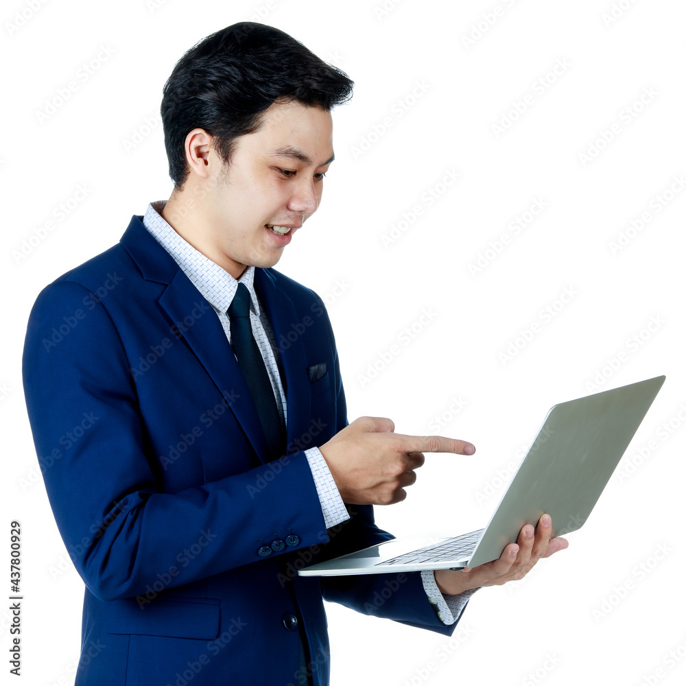Young attractive asian business man wearing navy blue suit with white shirt and necktie holding and using his laptop with one hand pointing finger at laptop on white background isolated Young attractive asian business man wearing navy blue suit with white shirt and necktie holding and using his laptop with one hand pointing finger at laptop on white background isolated