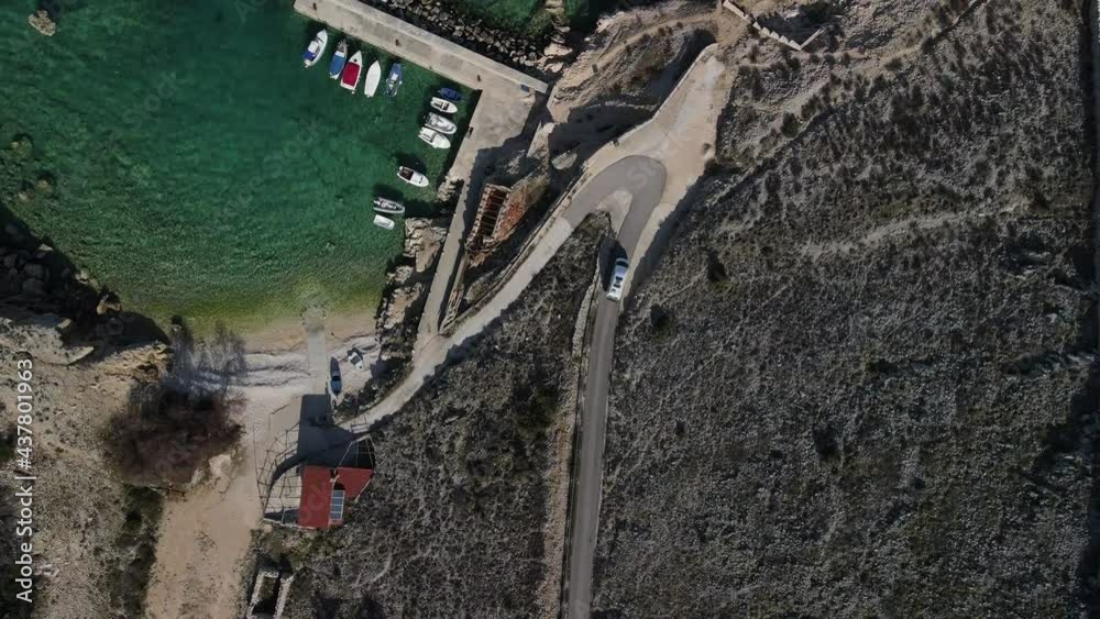 Tracking shot by drone arriving at the coast with the Adriatic Sea traveling in a white van take bird eye with boats in the harbor 4k Tracking shot by drone arriving at the coast with the Adriatic Sea traveling in a white van take bird eye with boats in the harbor 4k
