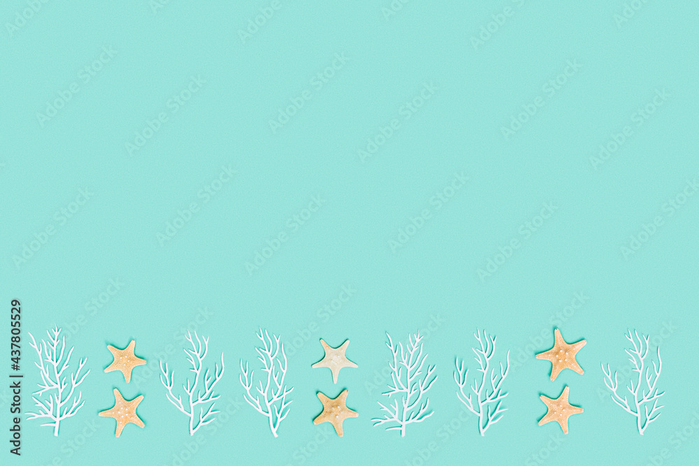 Summer nautic flat lay with sea stars and white coral on turquoise colored background. Summer nautic flat lay with sea stars and white coral on turquoise colored background.