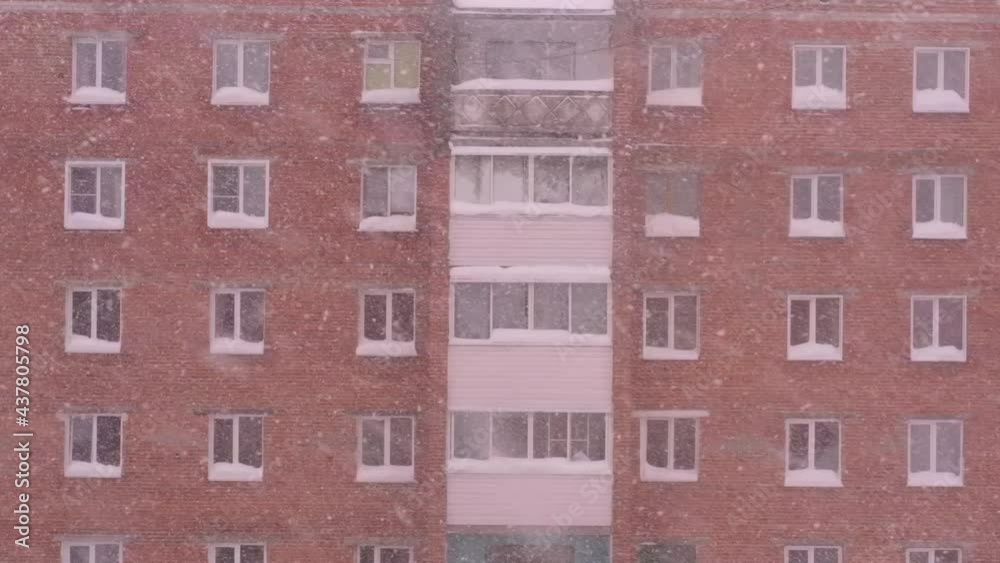 Heavy snowfall. snow covered cars in a snowdrift near houses in winter city Heavy snowfall. snow covered cars in a snowdrift near houses in winter city