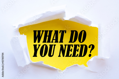 What Do You Need? word written under torn paper.