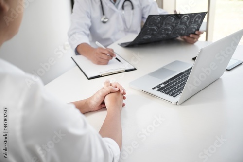Education profession  doctor in white uniform gown coat. Professional medical doctor with tablet and papers at seminar or hospital Coronavirus cancer healthcare