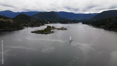 Aerial drone shot of sailboat in Pender Harbour, British Columbia. photo